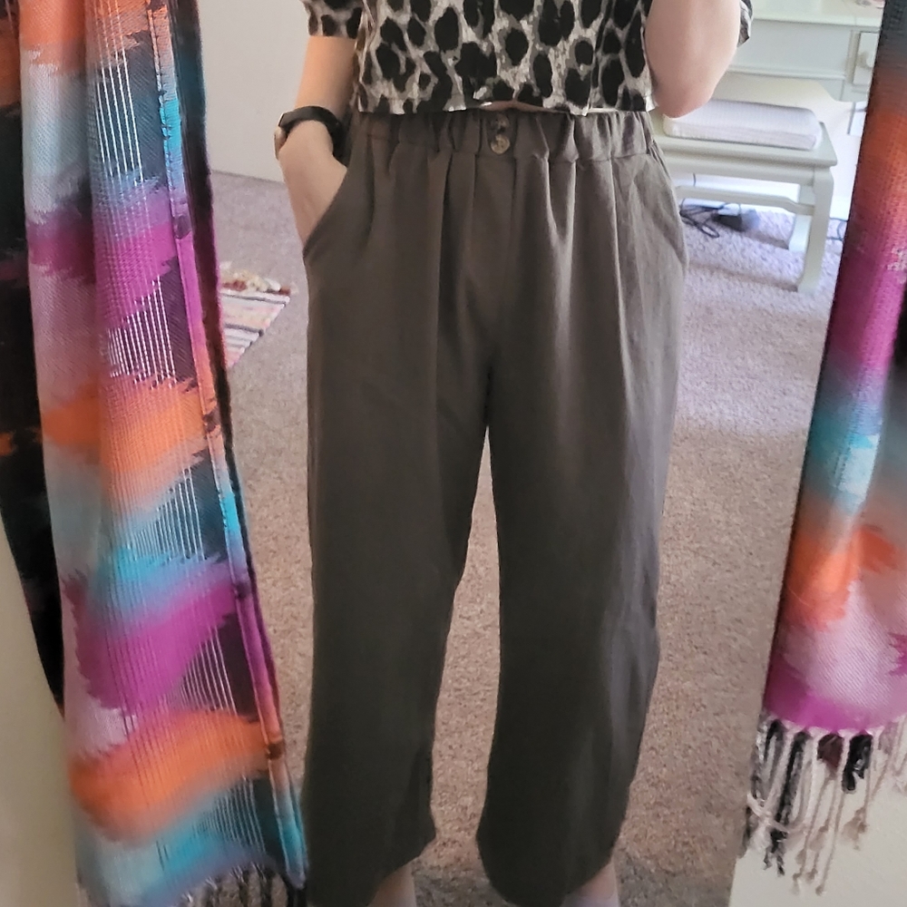 Long, wide-legged green pants.